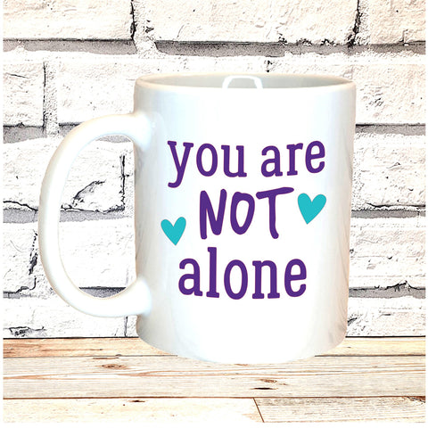 YOU ARE NOT ALONE MUG